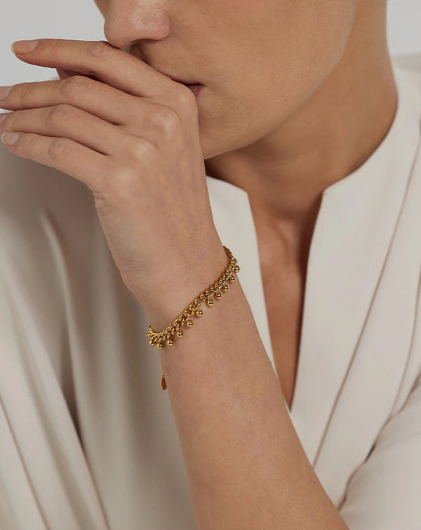 Nooré - Detaljernas dans i guld